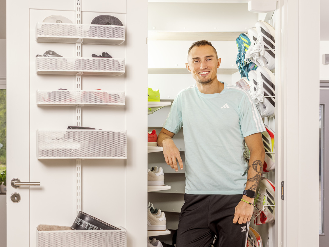 Thobias Montler in a storage room with accessories on door storage from Classic by Elfa.
