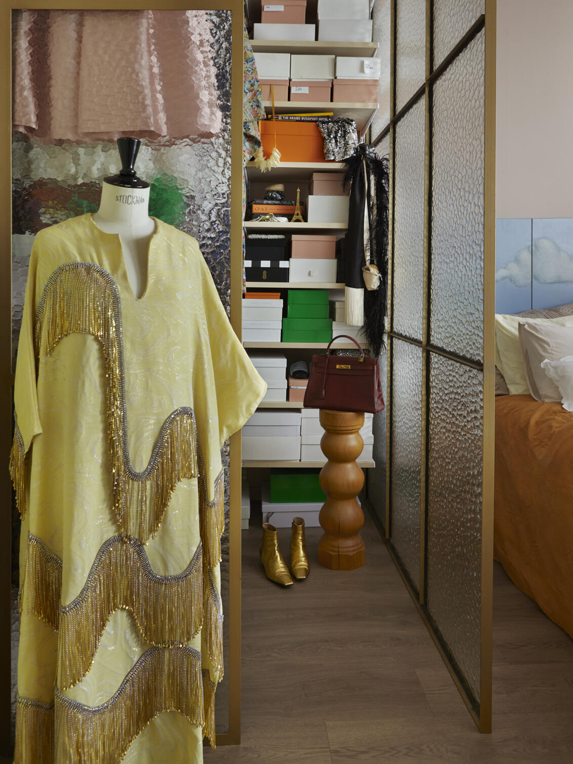 Décor+ by Elfa wardrobe with birch shelves, filled with shoe boxes.