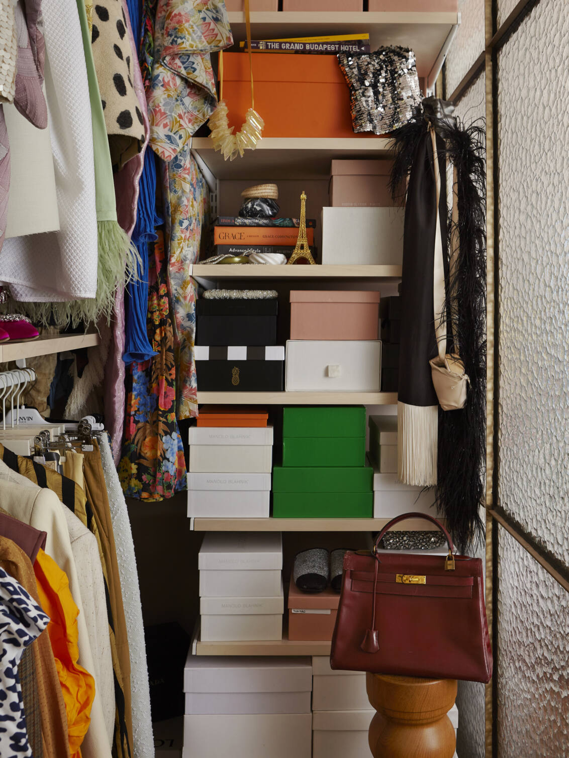 Décor+ by Elfa wardrobe with birch shelves, filled with shoe boxes.