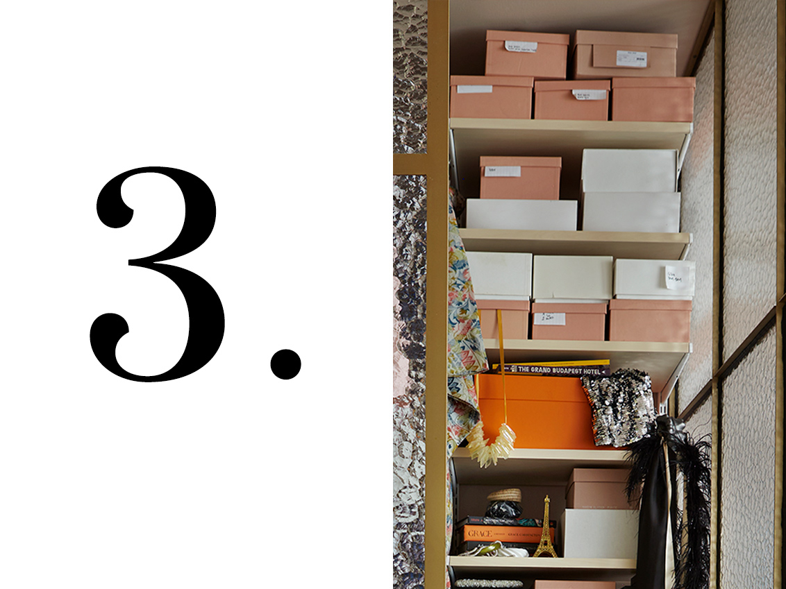 Décor+ by Elfa wardrobe with shelves in birch, filled with shoe boxes with labels.