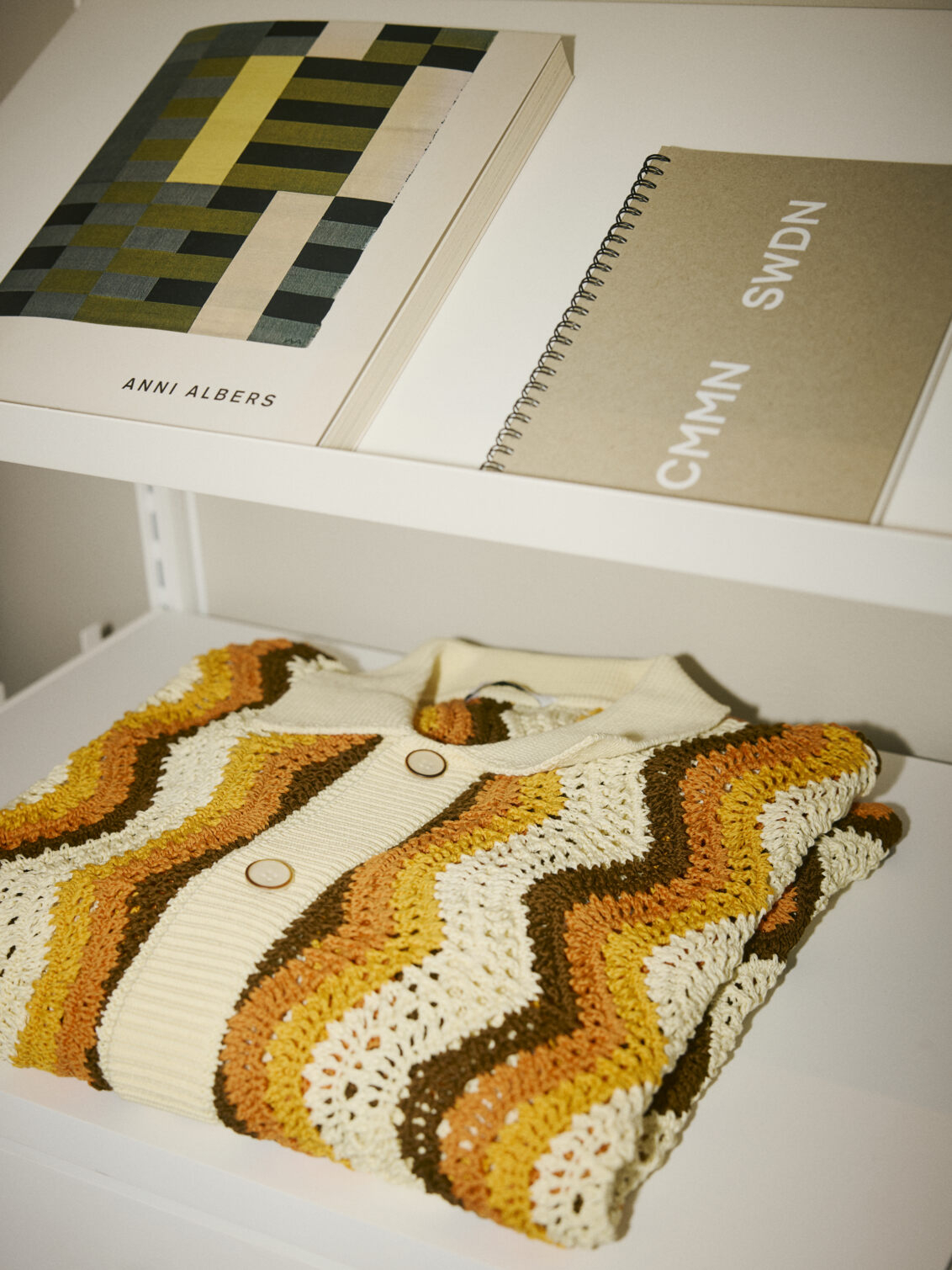 Knitted sweater in a Décor+ by Elfa wardrobe.