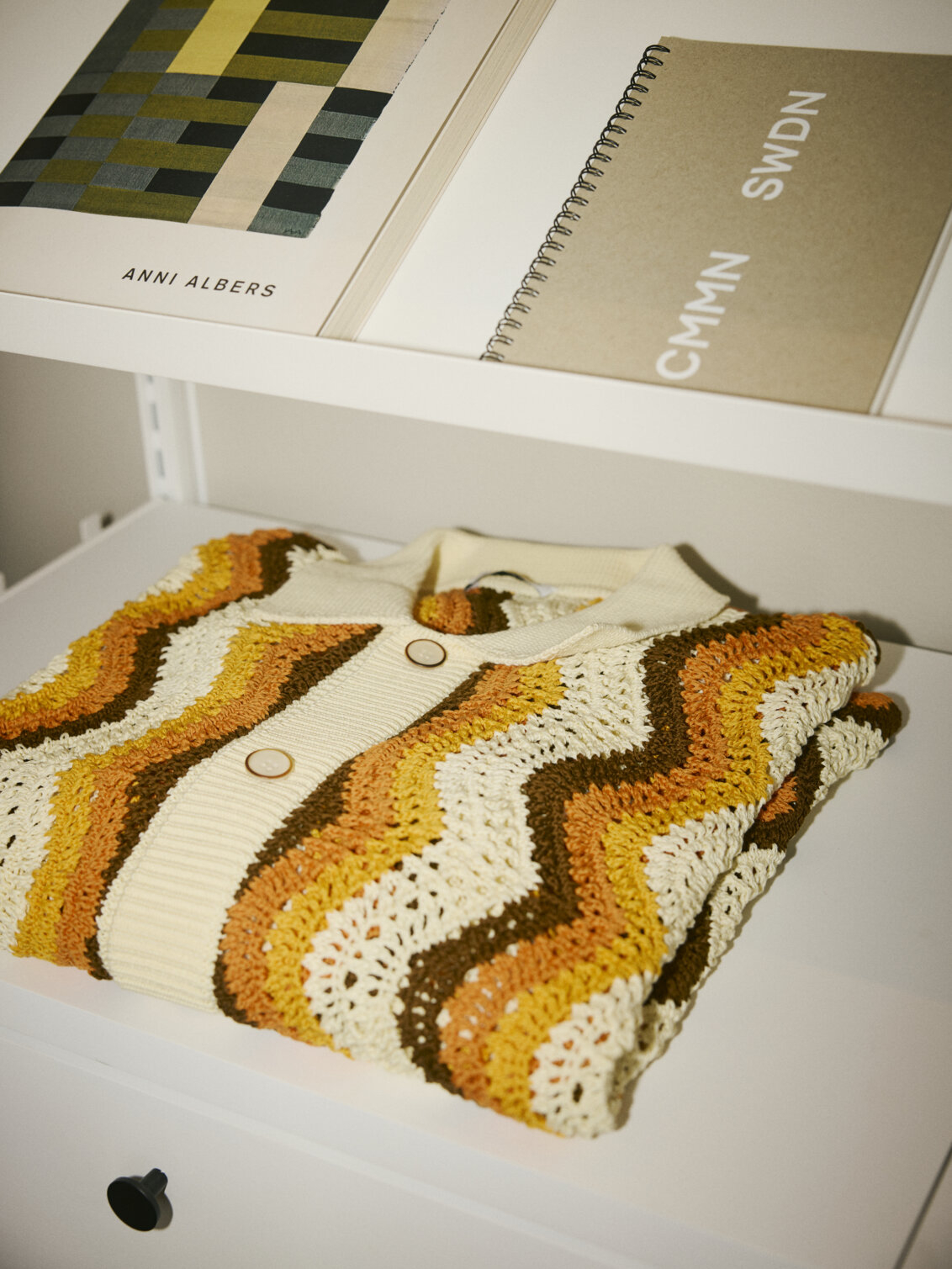 Knitted sweater in a Décor+ by Elfa wardrobe.