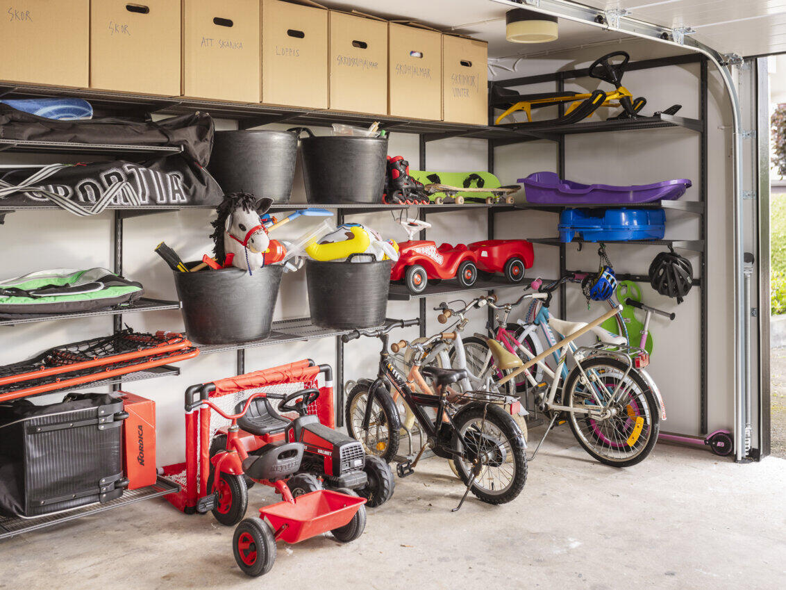 Garage with Garage+ storage from Elfa used for storing toys and children’s bicycles.