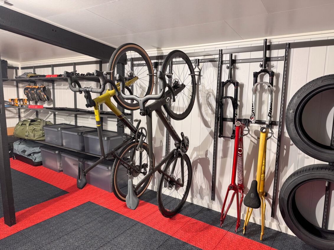 A garage with Garage+ by Elfa storage, where a couple of bikes hang on hooks.