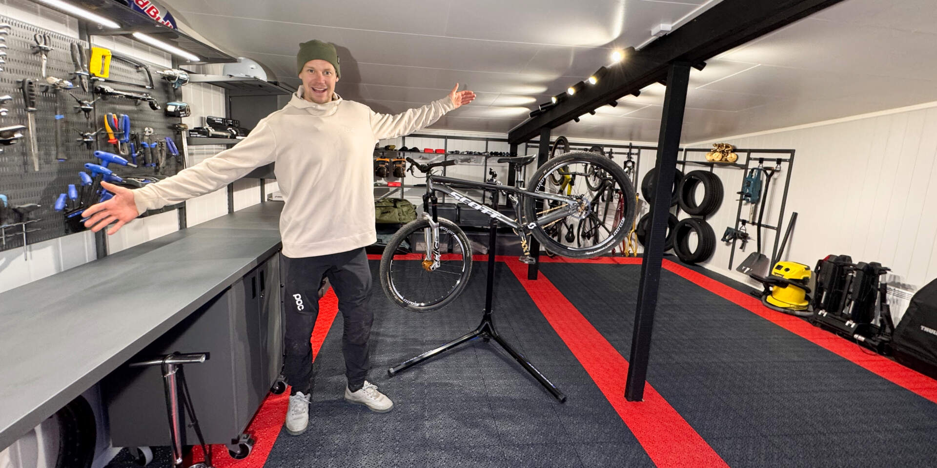 Martin Söderström in his garage with Garage+ by Elfa storage, with storage shelves, workbenches, shelves and cabinets.
