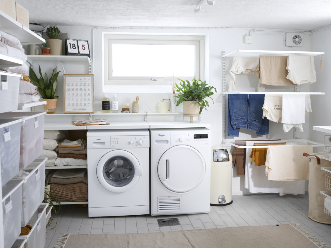 Large laundry room with many storage options