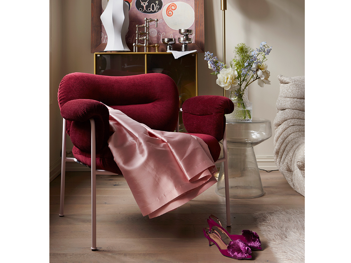 Red armchair in Caroline’s living room.
