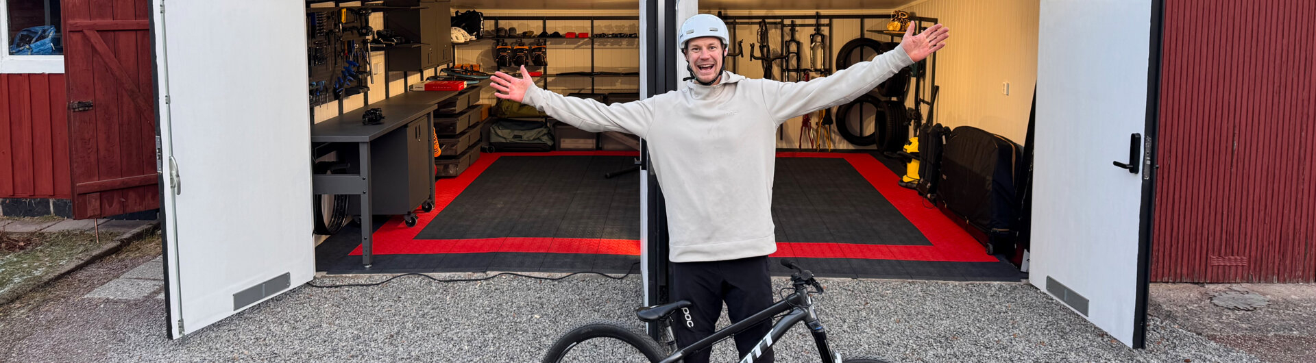 Martin Söderström outside his garage which contains Garage+ by Elfa storage, consisting of workbenches, cabinets and drawers.
