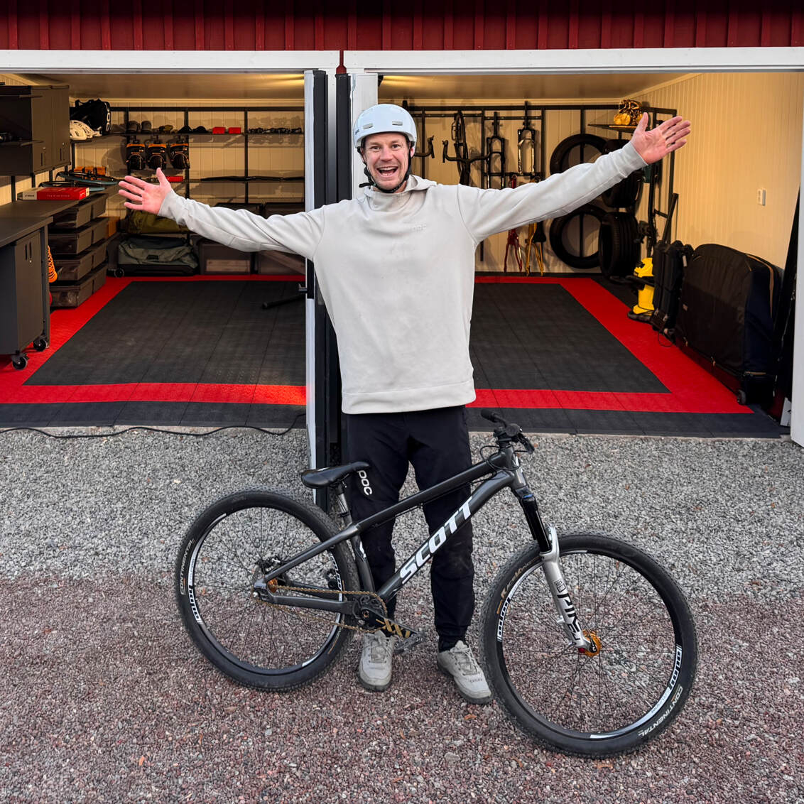 Martin Söderström outside his garage which contains Garage+ by Elfa storage, consisting of workbenches, cabinets and drawers.