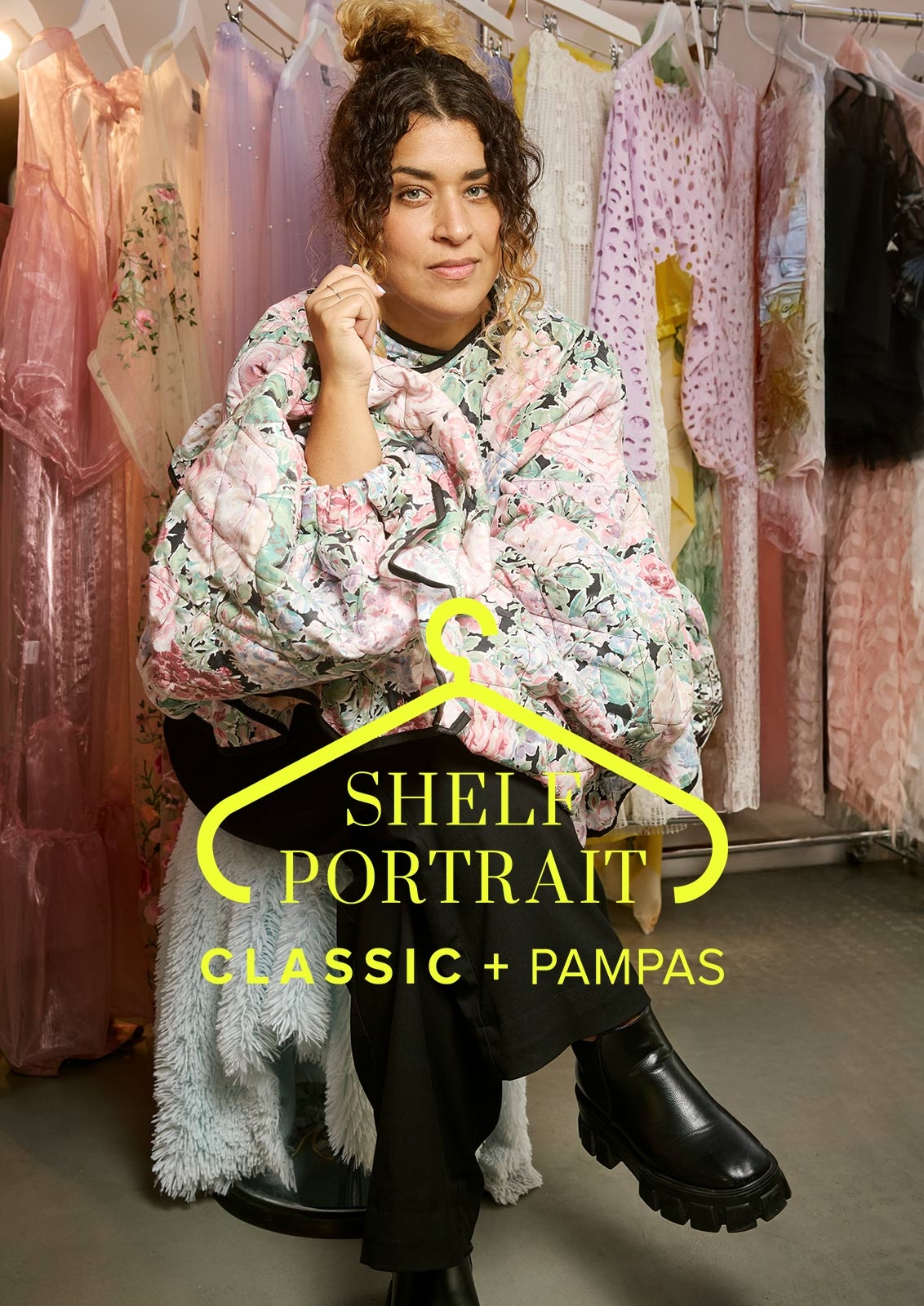 Linnea Samia Khalil is sitting on a stool in front of clothes rails with Pampas clothes.