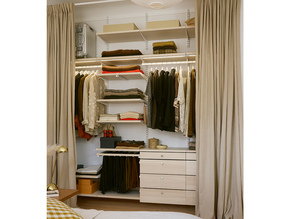 Décor+ by Elfa wardrobe in white and birch, with hanging clothing, pant rack and pull-out drawers.