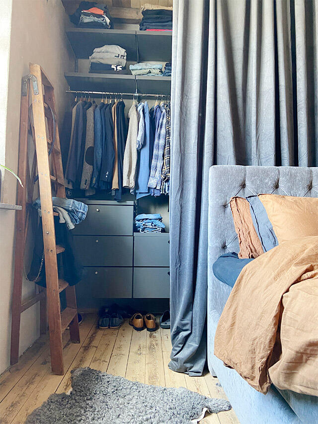 Smaller wardrobe in bedroom with storage for clothes