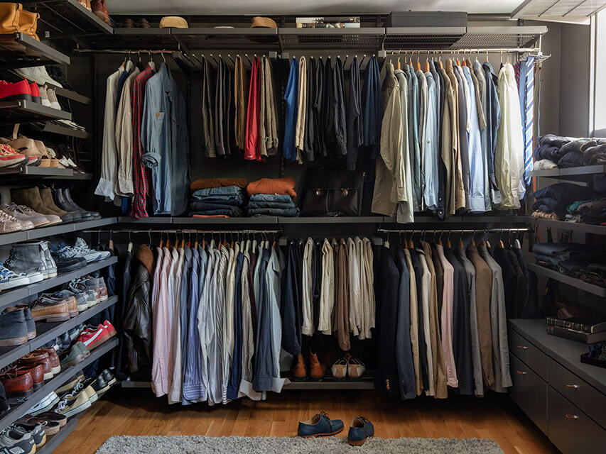 Partner side of the dressing room with gathered storage for all types of clothes and equipment, cleverly organized with Elfa system.