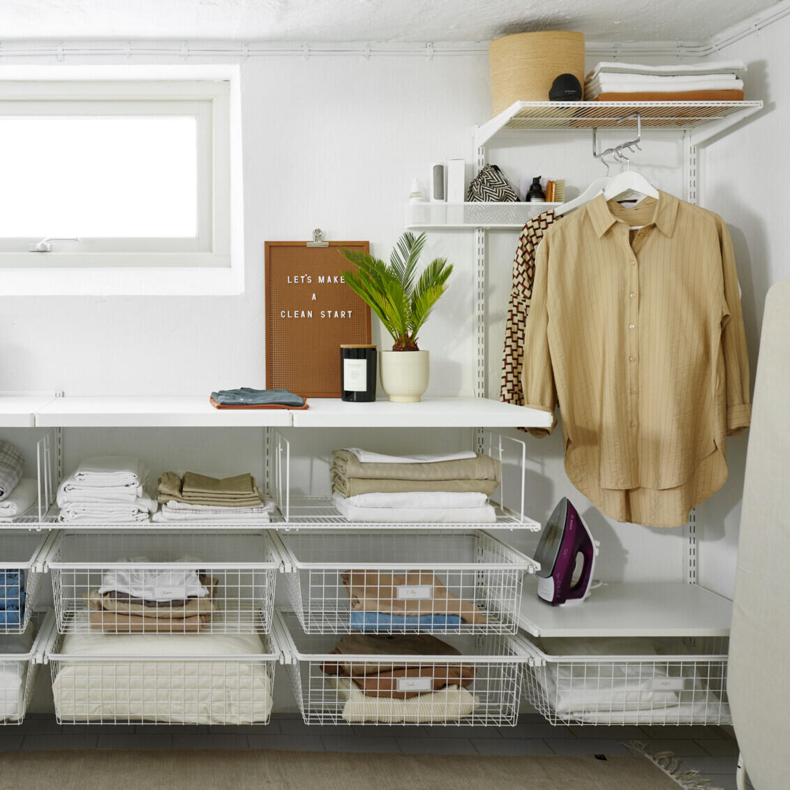laundry room with wire shelves and wire baskets in a gliding frame for convenient and airy storage of laundry