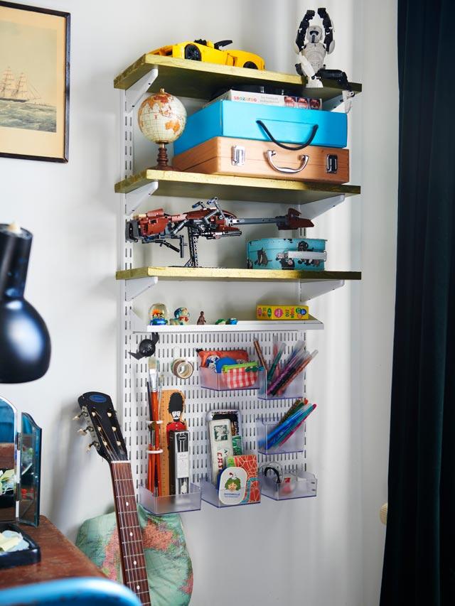 Elfa wall shelf with toys, suitcases and collectibles in children's rooms