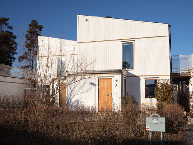 varmdo Modern Scandinavian white house with wooden door and minimalist architecture