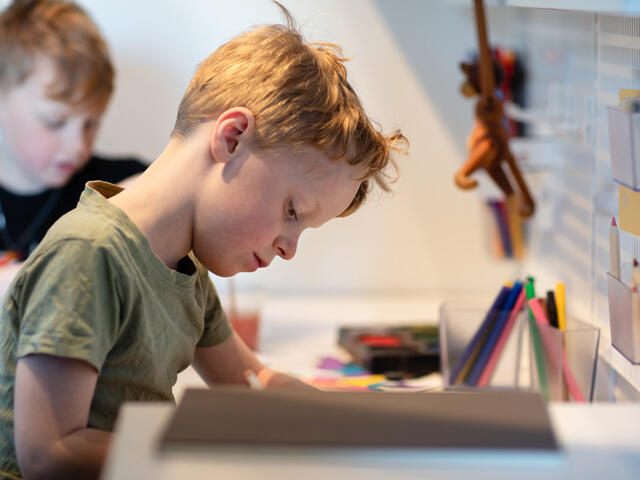 varmdo Children's study area with art supplies, need organization system