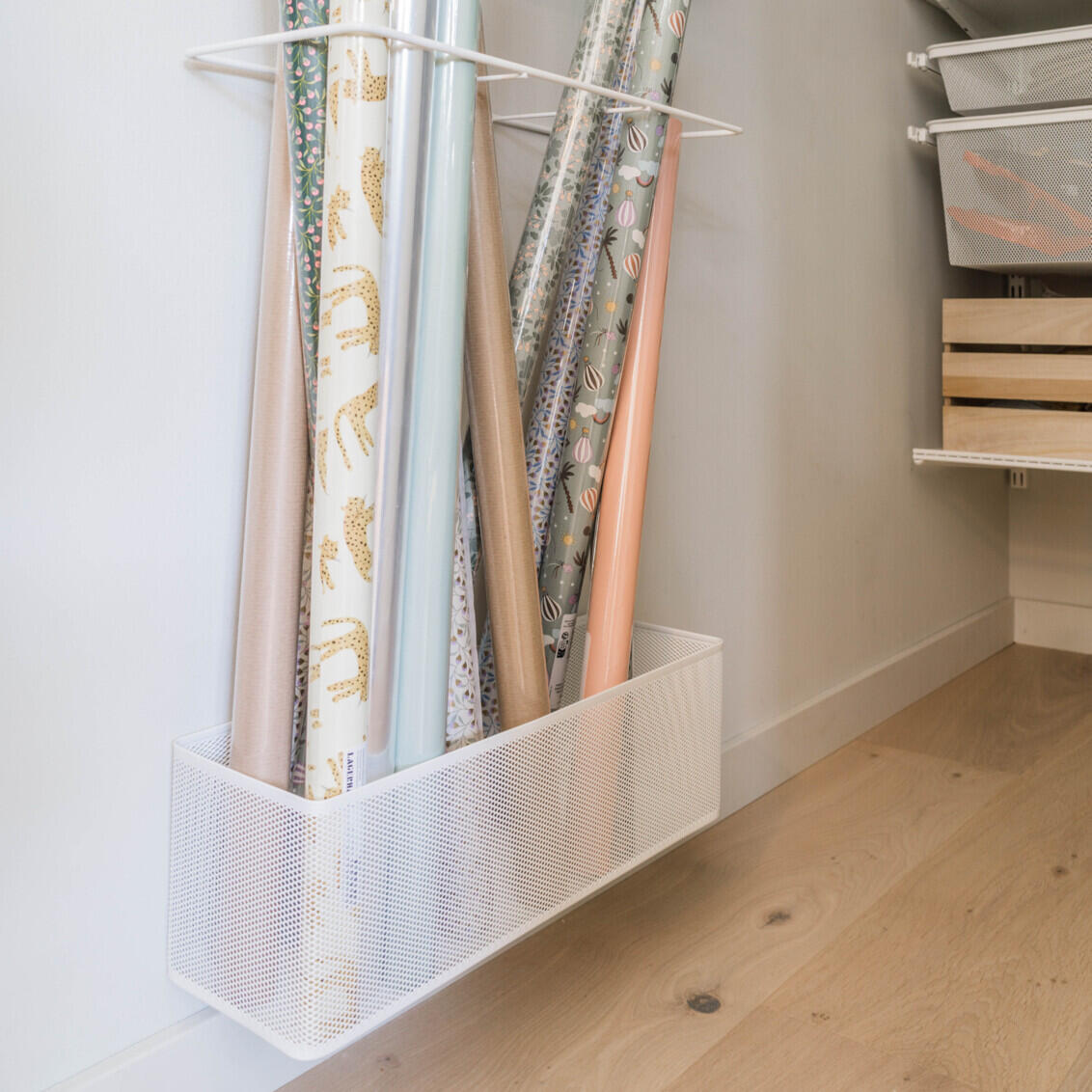 Elfa storage solution for gift wrapping paper with vertical dividers