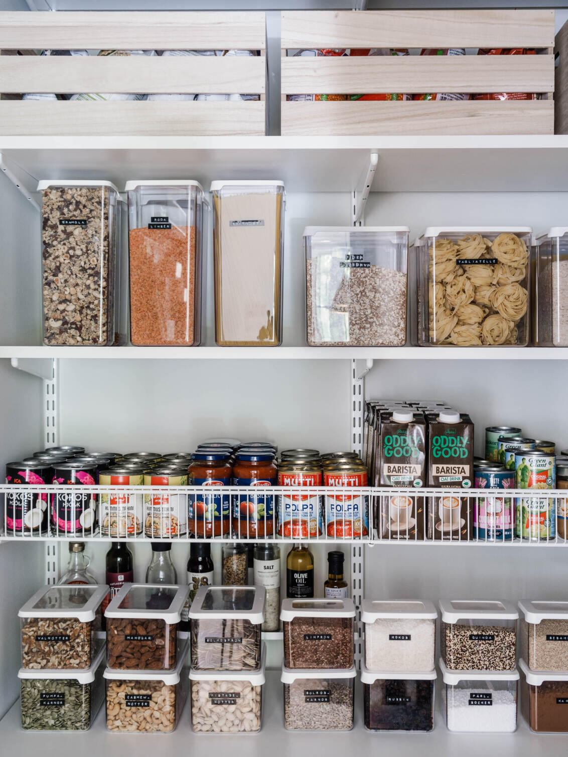 Elfa shelving system with labelled food containers and wire basket organiser
