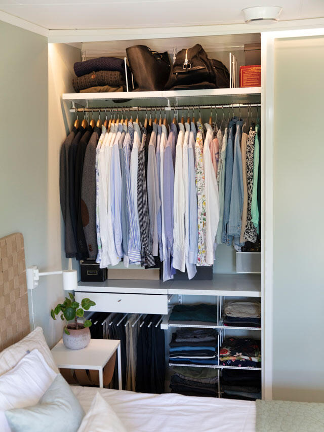 bedroom by Elfa wardrobe solution shows clothes in order