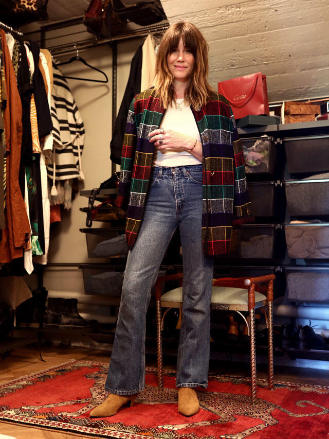 Walk-in closet Jessica Blanken's Elfa wardrobe system with clothes rack and storage drawers