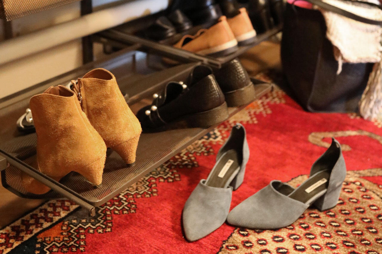 Elfa shoe rack with wire mesh shelves for shoe display