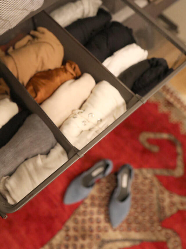 Elfa wire box with neatly folded clothes
