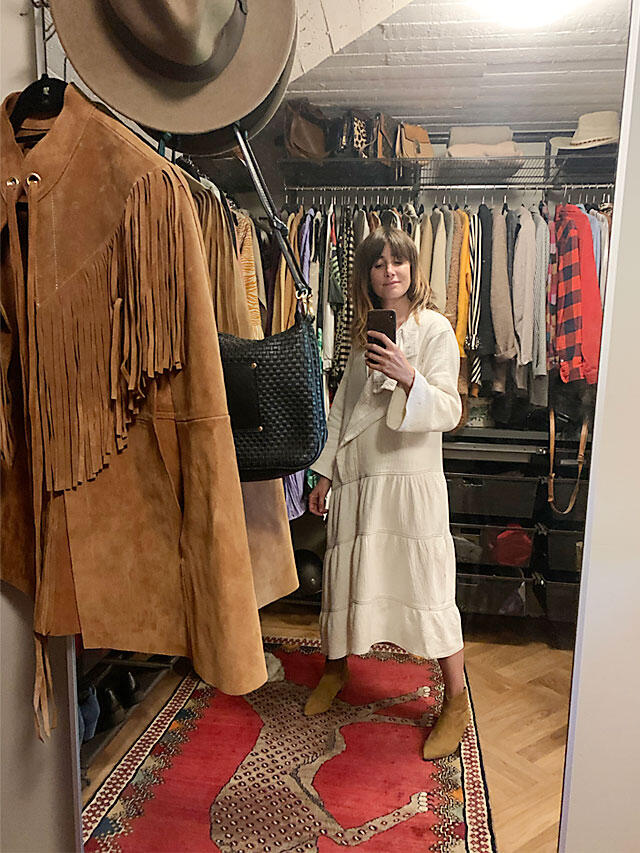 Elfa walk-in wardrobe with organised clothes rails and drawers