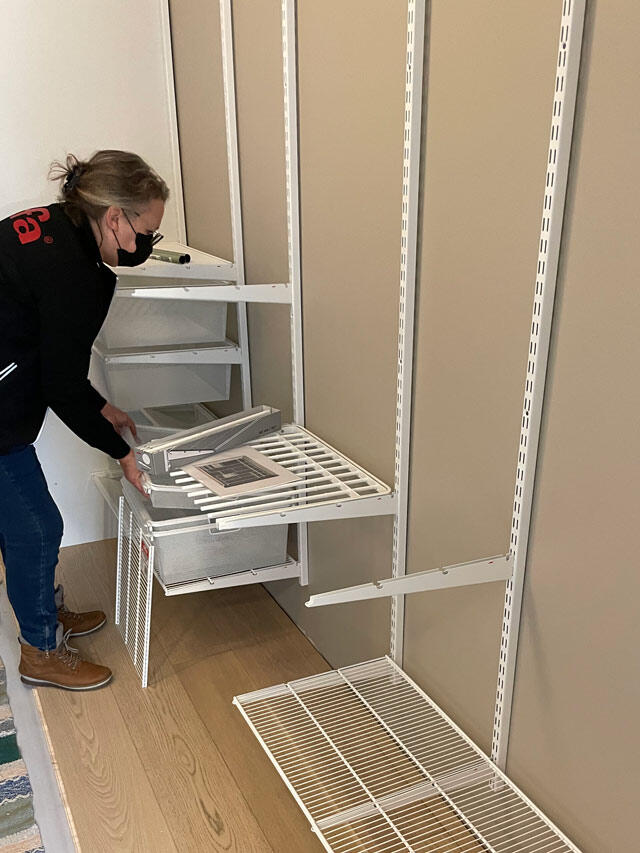 Installation of Elfa wardrobe system with wire mesh shelves