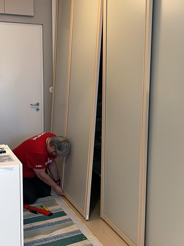 Elfa sliding door wardrobe during installation
