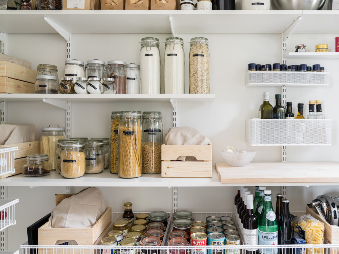 Shop with shelves and wire shelves from Elfa filled with glassmakers, spices and bottles.