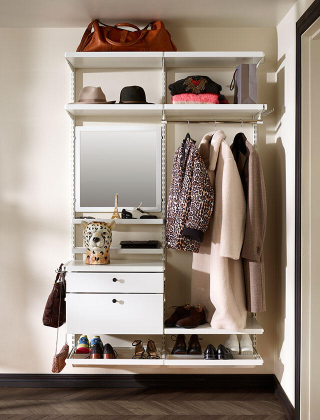 Wall-mounted storage in the hallway with shelves, mirror, shoe rack and pull-out drawer with front.