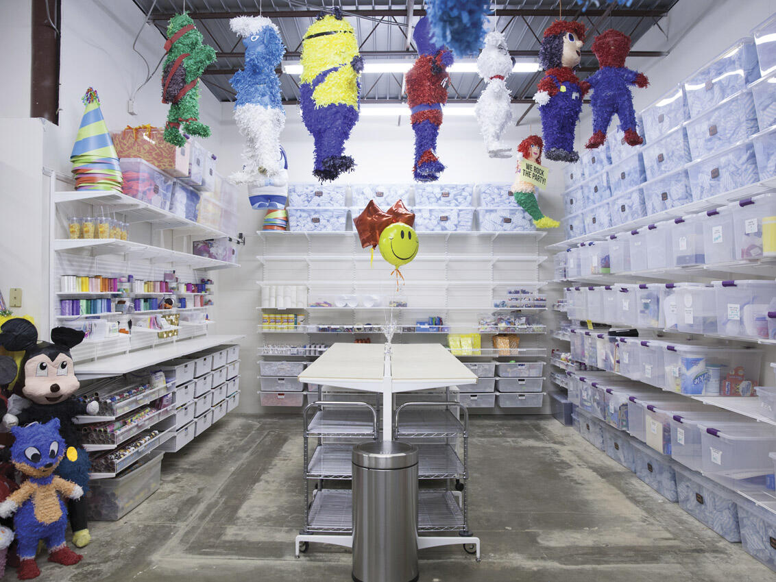 Food storage in mesh drawers and shelves in pantry.