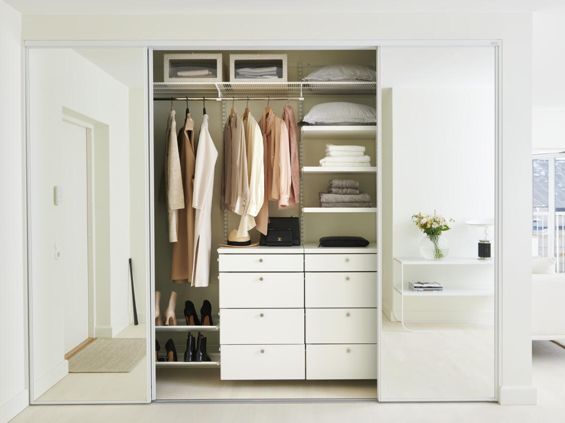 Wardrobe in master bedroom with sliding doors in Original with glass filling and clothes storage.