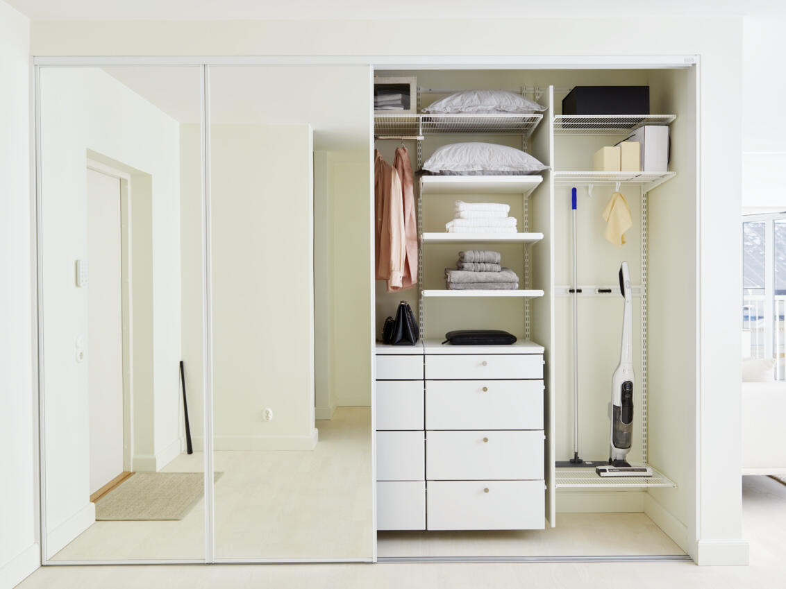 Wardrobe in master bedroom with sliding doors in Original with glass filling and clothes storage.